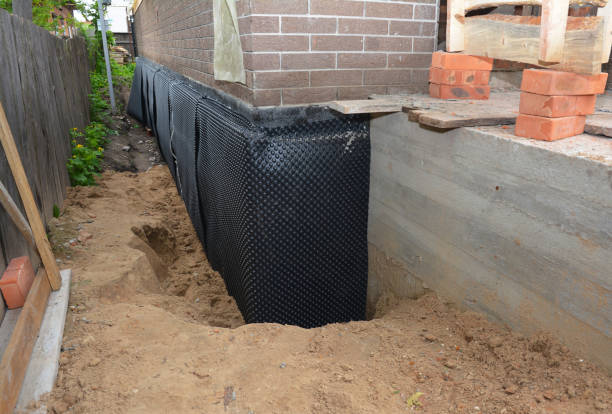 Happy homeowners after waterproofing job in Crivitz
